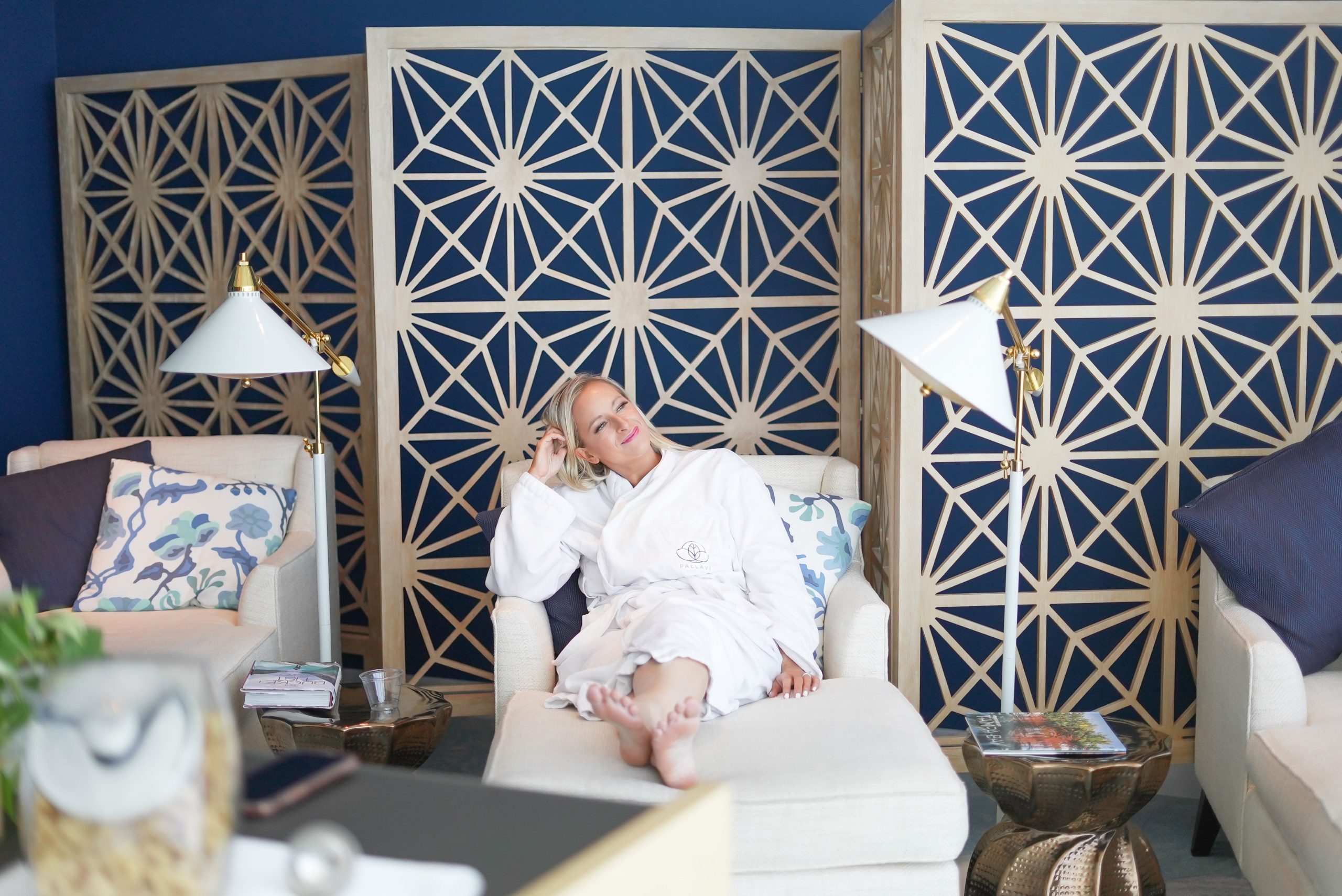 Florida Blogger, The Lovely flamingo, Jill DiGioia, lounges in the relaxation room at the Pallavi Spa in a cozy robe.