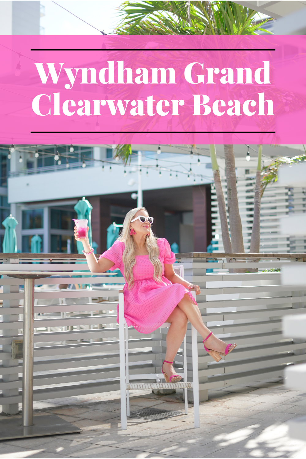 Florida Blogger, Jill DiGioia sits in a hot pink dress at the Wyndham Grand Clearwater Beach