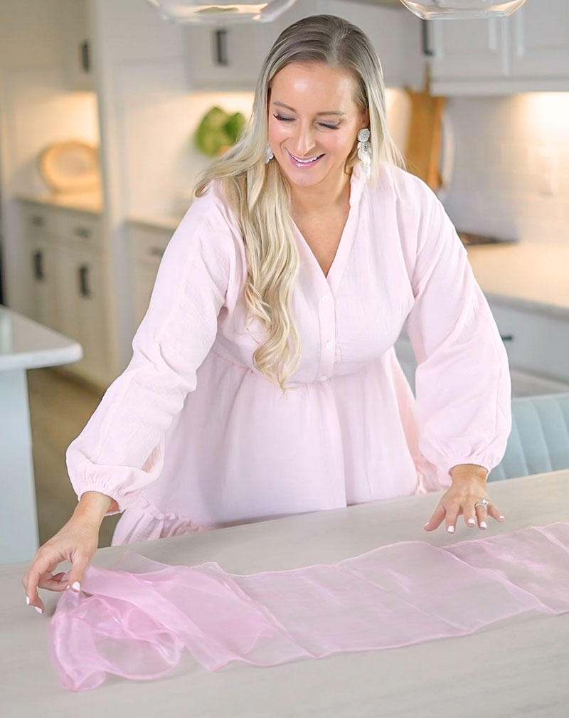 Florida lifestyle and home blogger Jill DiGioia shares an easy spring tablescape starting with a sheer pink table runner.
