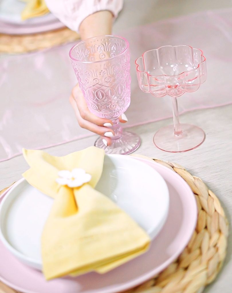 Florida lifestyle and home blogger Jill DiGioia shares an easy spring tablescape using pink wine glasses and vintage pink water glasses.