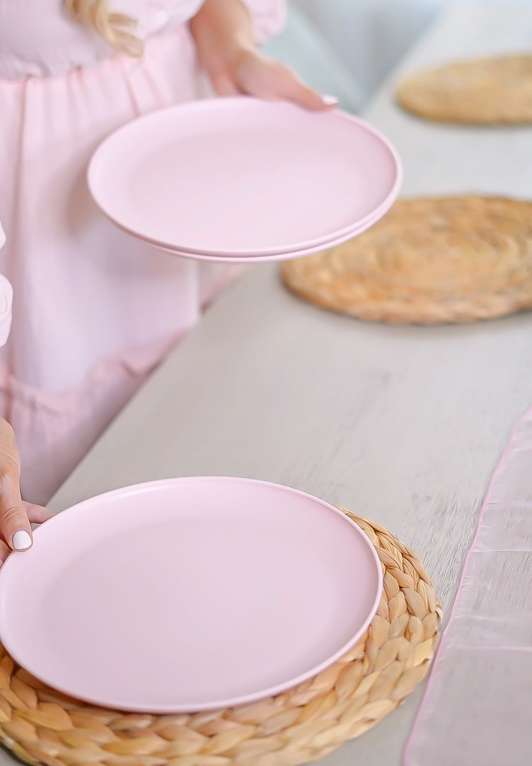Florida lifestyle and home blogger Jill DiGioia shares an easy spring tablescape layering woven placemats and pink plates.