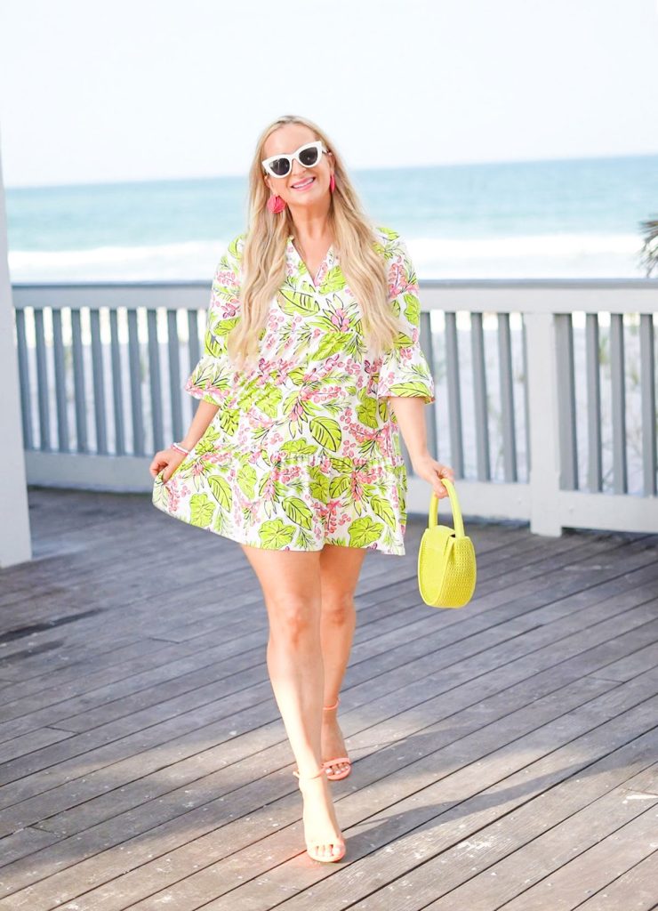 Florida influencer wears a green and pink summer dress.