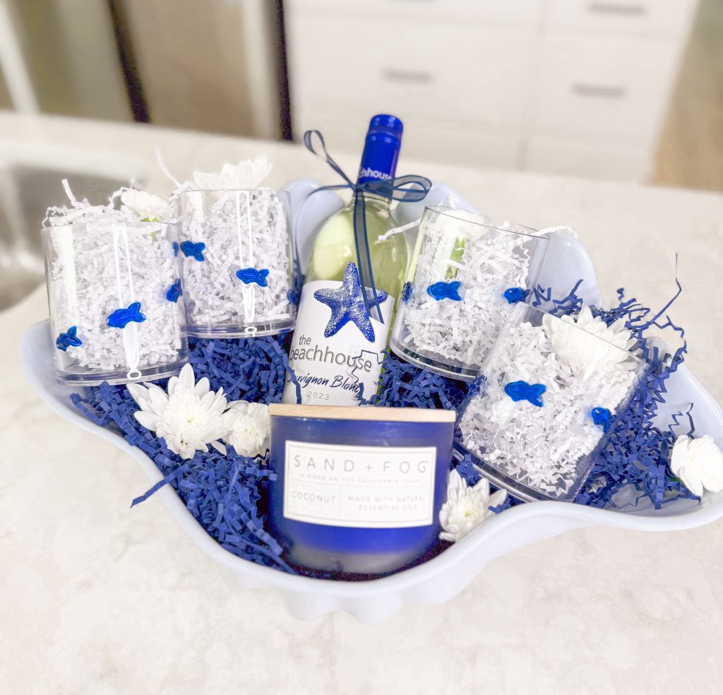 Florida Lifestyle blogger share a creative summer gift basket idea made with a shell bowl, fish glasses, beach wine and more.
