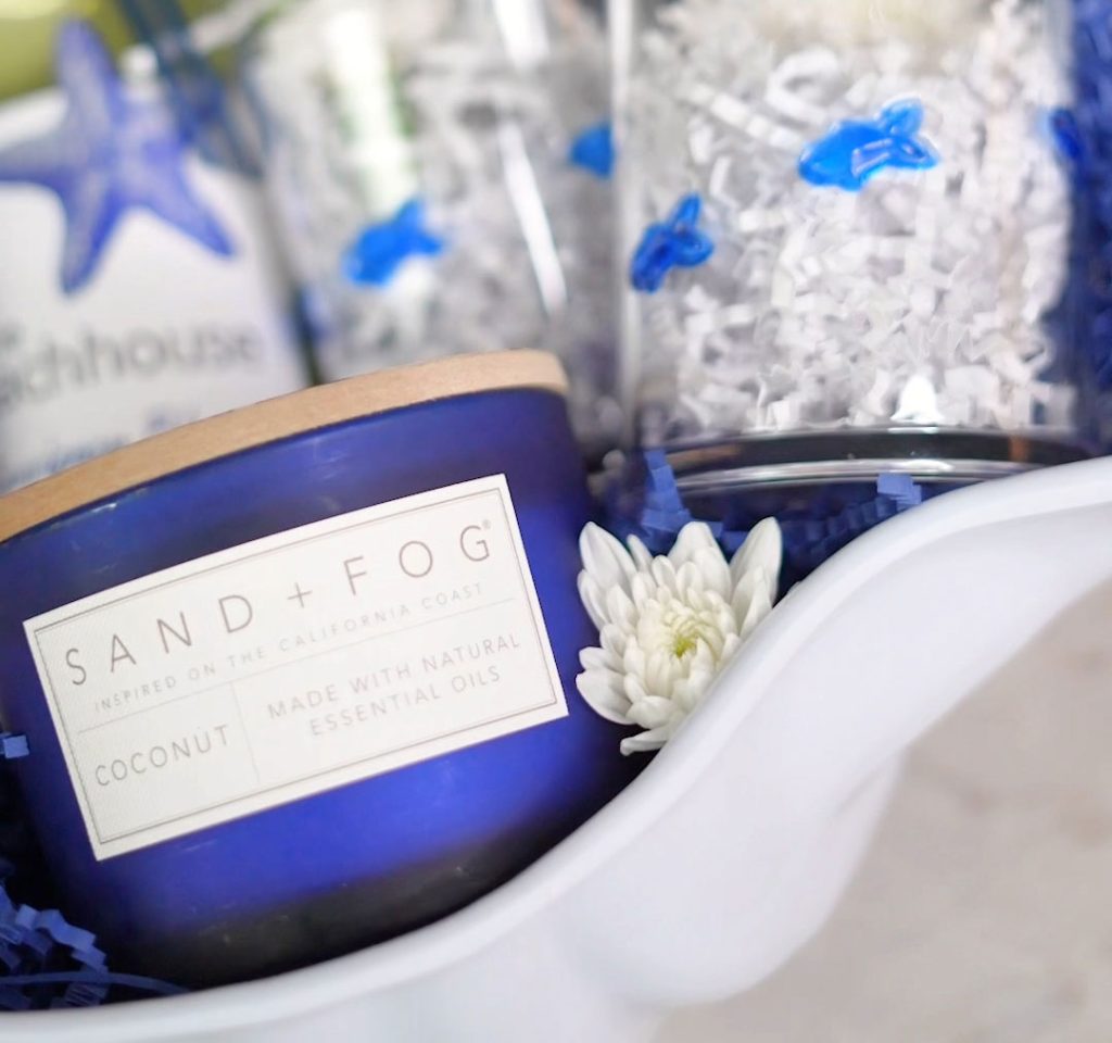 Florida Lifestyle blogger shares a summer gift basket idea with a navy blue coconut candle.